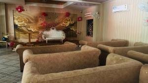 Event lounge with sofa seating and feature backdrop