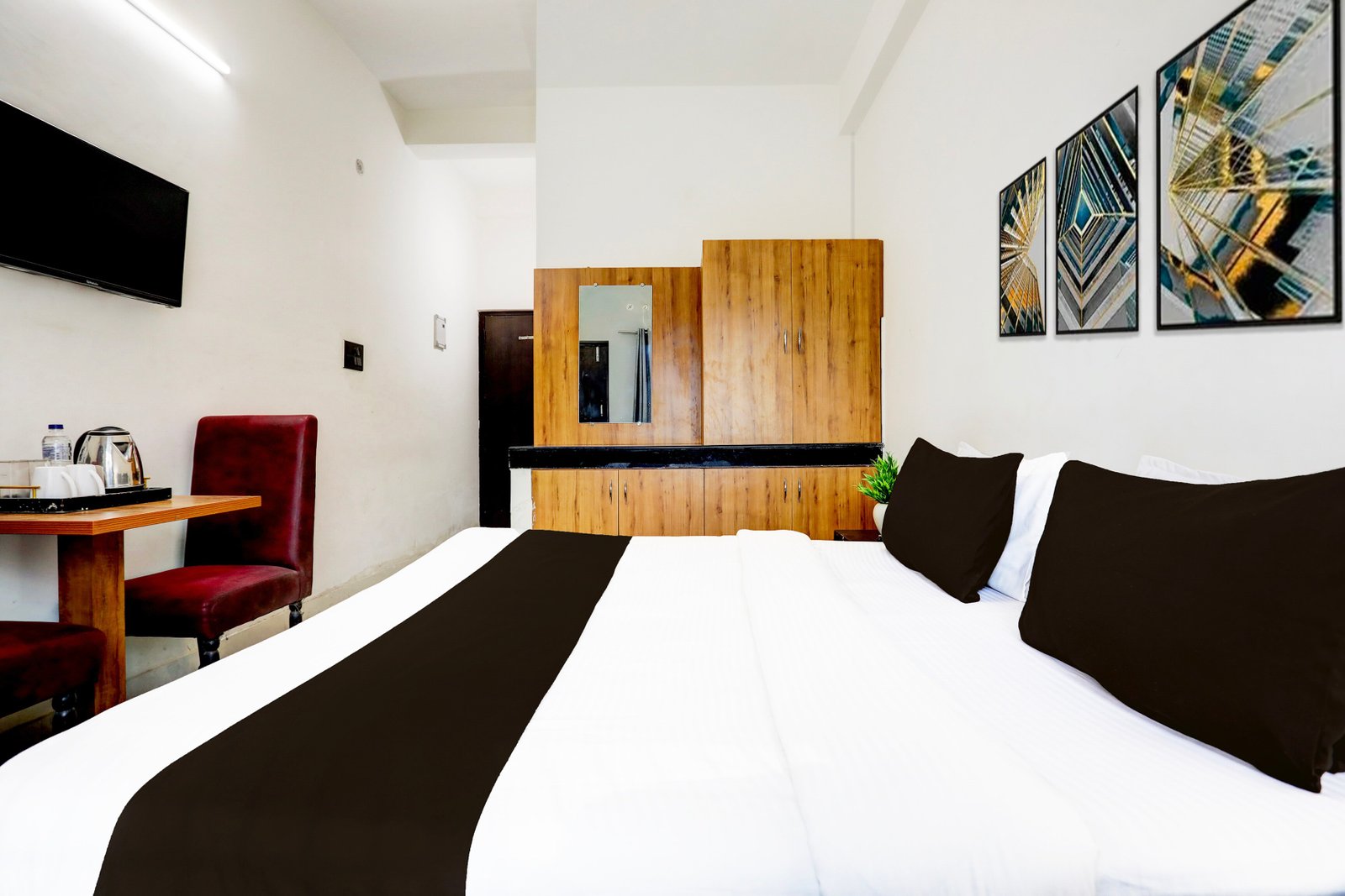 King bed guest room at Hotel Shivam Grand Inn