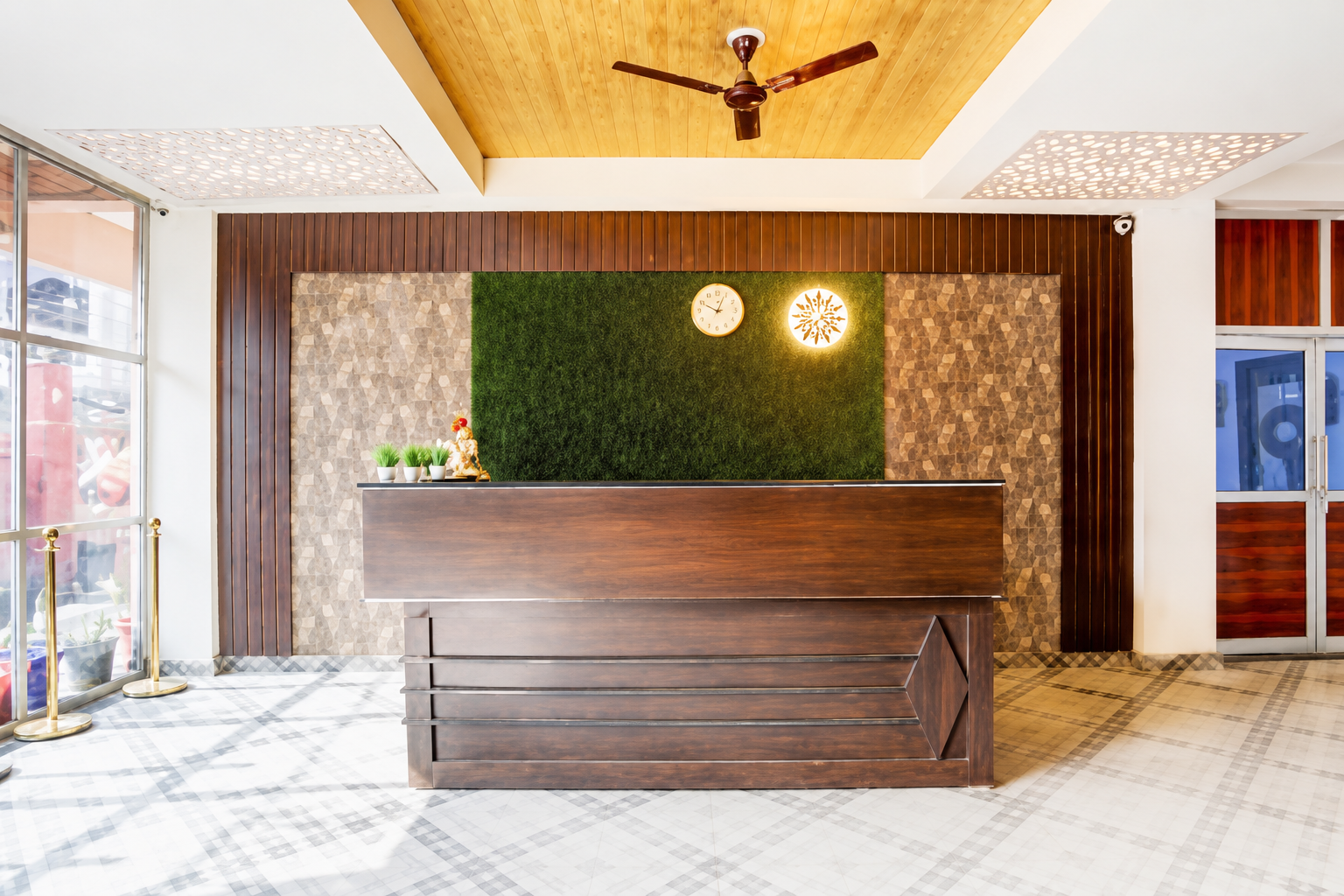 Reception desk with green feature wall